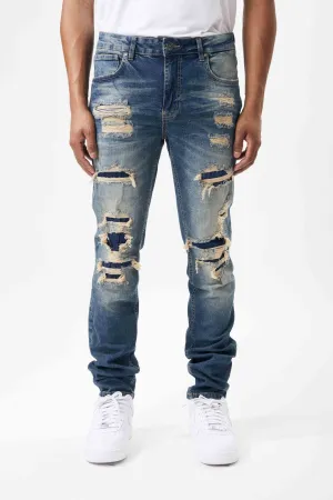 Ripped and Repaired Denim Jeans in Tint Blue