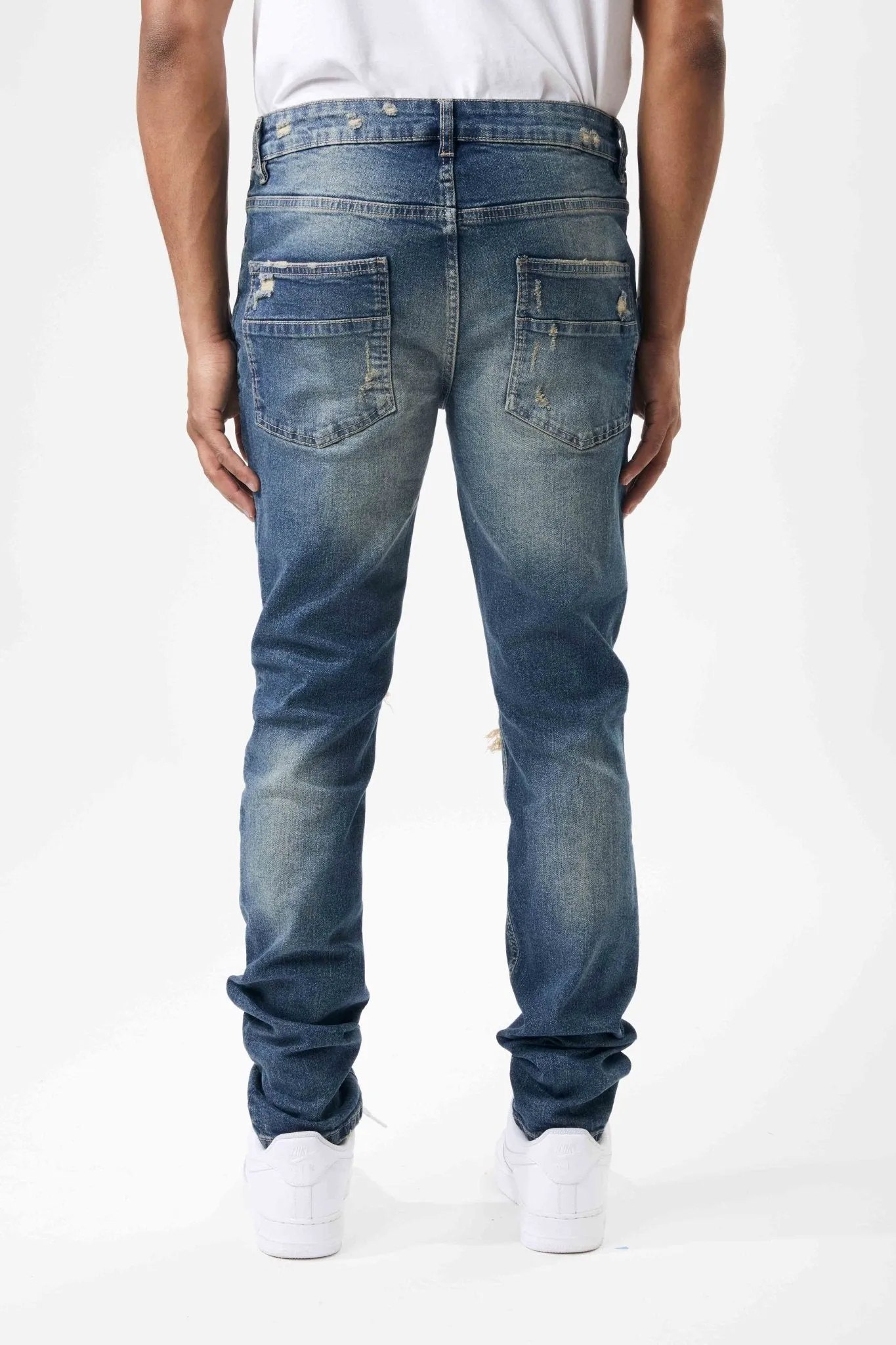 Ripped and Repaired Denim Jeans in Tint Blue