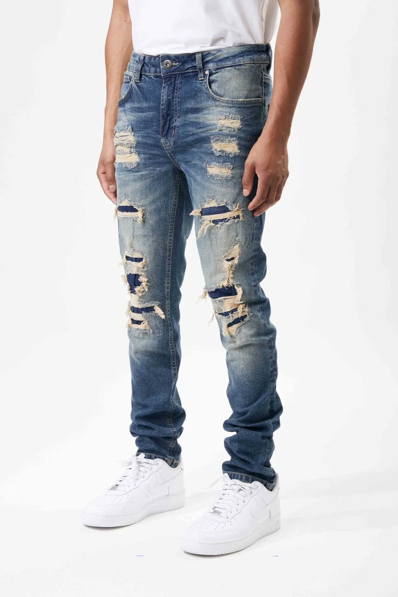 Ripped and Repaired Denim Jeans in Tint Blue