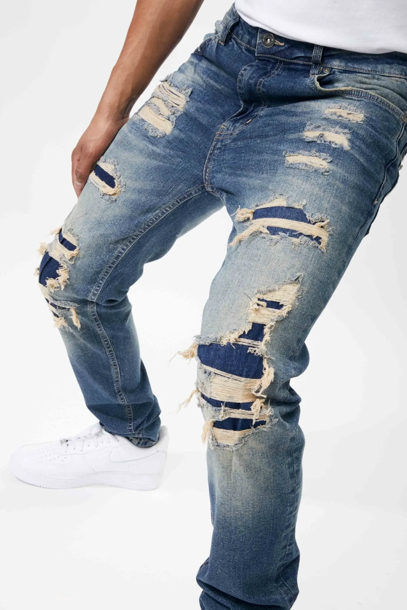 Ripped and Repaired Denim Jeans in Tint Blue