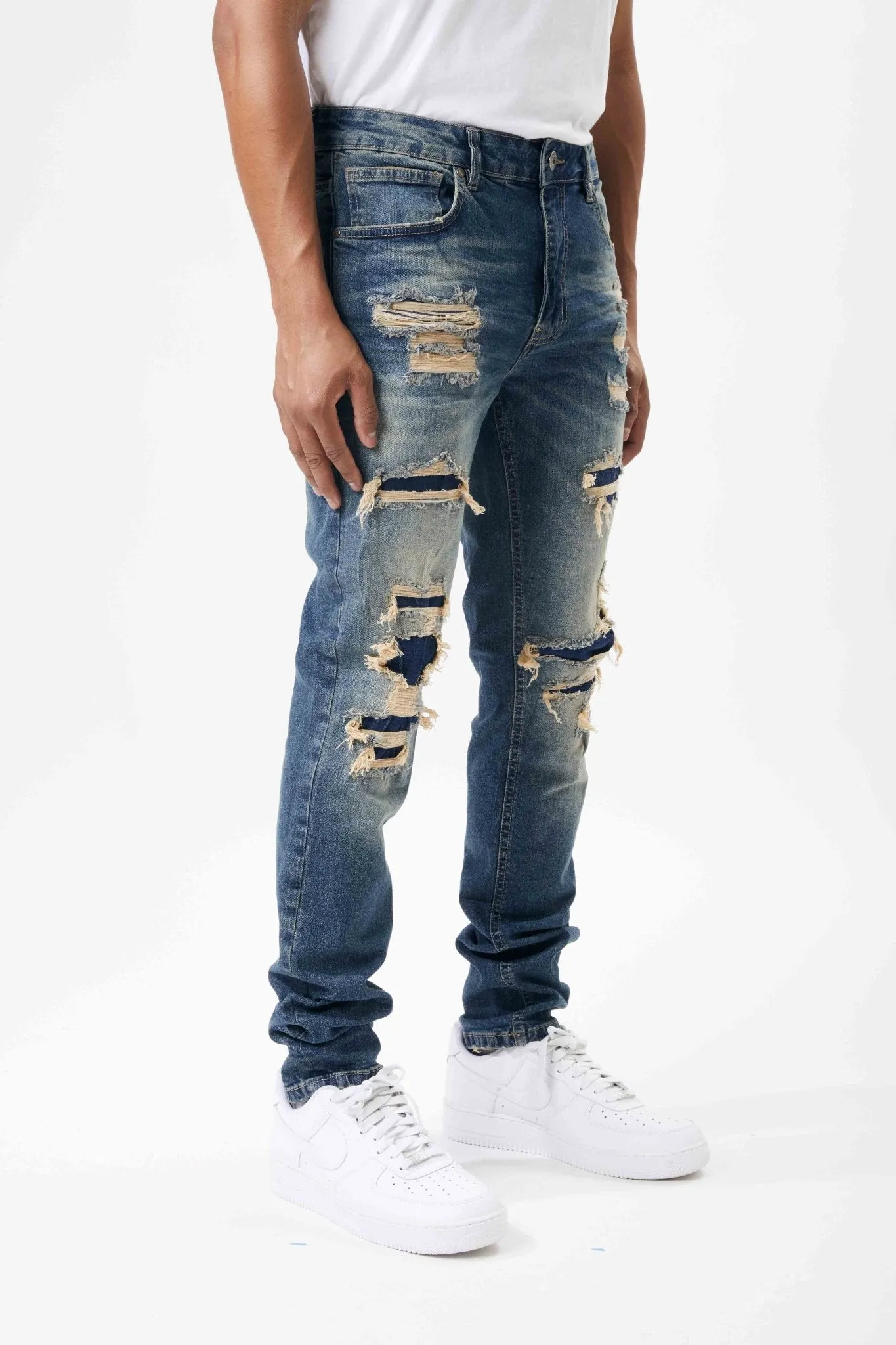 Ripped and Repaired Denim Jeans in Tint Blue